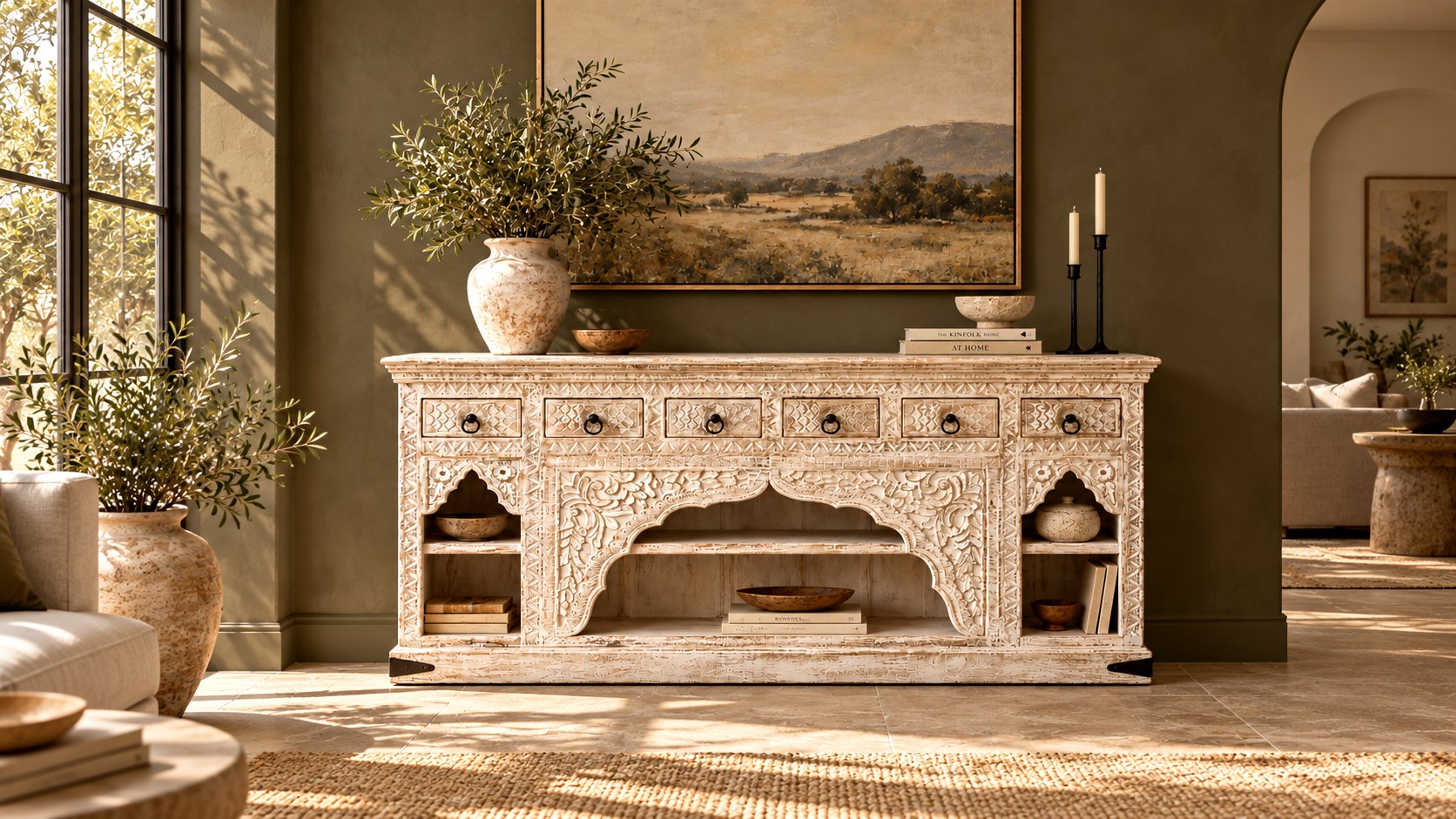 Hand-carved whitewashed sideboard in a sunlit living room